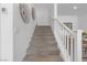 Carpeted staircase with white railing leading to the second floor at 236 Callen Falls Ave # 1211, Henderson, NV 89011