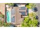 Picture of the house from an aerial view with a pool, solar panels and lush landscaping at 2426 La Pluma St, Henderson, NV 89014
