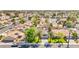 Overhead view of a home with a well-manicured yard, palm trees, and a solar panel roof at 2426 La Pluma St, Henderson, NV 89014