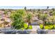 Aerial view of a home with mature trees and a well-maintained lawn in a residential neighborhood at 2426 La Pluma St, Henderson, NV 89014