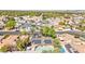 Residential area aerial view showcasing the home, palm trees, landscaping, and nearby street at 2426 La Pluma St, Henderson, NV 89014