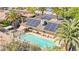 Aerial view showcasing a pool, solar panels, and an outdoor lounging area at 2426 La Pluma St, Henderson, NV 89014