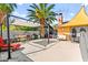 Relaxing backyard featuring a pergola, sitting area, and mature trees, ideal for entertaining at 2426 La Pluma St, Henderson, NV 89014