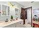 Bathroom featuring neutral tones, double sink vanity, and bright lighting at 2426 La Pluma St, Henderson, NV 89014