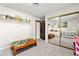 Bedroom with mirrorred closet, neutral tones, filled with playful toys, and carpet flooring at 2426 La Pluma St, Henderson, NV 89014