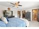 Comfortable bedroom with a ceiling fan, ensuite bathroom access, and a large closet at 2426 La Pluma St, Henderson, NV 89014