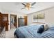 Comfortable bedroom with a ceiling fan and natural light, closet, and access to the ensuite bathroom at 2426 La Pluma St, Henderson, NV 89014