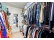 Spacious walk-in closet filled with organized clothing and accessories, offering ample storage at 2426 La Pluma St, Henderson, NV 89014