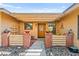 Charming entryway featuring a wooden door, brick columns, and decorative accents at 2426 La Pluma St, Henderson, NV 89014