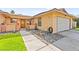 Welcoming home featuring a well-manicured lawn, rock garden, and charming front entrance at 2426 La Pluma St, Henderson, NV 89014