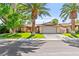 Charming single-story home with mature landscaping and a well-maintained lawn at 2426 La Pluma St, Henderson, NV 89014