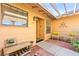 Cozy front porch area with seating, stylish decor, and a covered entryway at 2426 La Pluma St, Henderson, NV 89014