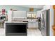 Bright kitchen with butcher block countertops, subway tile backsplash, and stainless steel refrigerator at 2426 La Pluma St, Henderson, NV 89014
