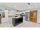Spacious kitchen features white cabinets, stainless steel appliances, and a dark-stained center island at 2426 La Pluma St, Henderson, NV 89014