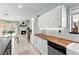 Bright kitchen boasts butcher block counters, white cabinets, and a stone fireplace in the background at 2426 La Pluma St, Henderson, NV 89014