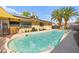 Stunning pool, surrounded by lush landscaping, perfect for outdoor entertaining at 2426 La Pluma St, Henderson, NV 89014