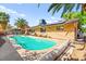 Sparkling pool is the focal point of the backyard oasis, surrounded by lush landscaping at 2426 La Pluma St, Henderson, NV 89014