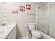 Updated bathroom features a single sink, shower, and artwork at 2460 Old Forge Ln # 48, Las Vegas, NV 89121