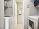 Convenient laundry room with washer, dryer, and storage shelves at 2460 Old Forge Ln # 48, Las Vegas, NV 89121