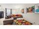 Bright living room with contemporary decor, plush sofa, and natural light at 2460 Old Forge Ln # 48, Las Vegas, NV 89121