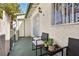 Relaxing front patio with seating area and wrought iron security door at 2460 Old Forge Ln # 48, Las Vegas, NV 89121