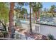 Community pool area surrounded by mature trees and landscaping at 2460 Old Forge Ln # 48, Las Vegas, NV 89121