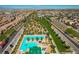 Expansive aerial view of the community showcasing the pool, park, and residential neighborhood at 2871 Tanager Hill St, Henderson, NV 89044