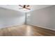 A bedroom with wood-look floors, neutral walls, and a ceiling fan at 2871 Tanager Hill St, Henderson, NV 89044