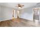 Spacious bedroom with wood-look floors and views into the bathroom and closet at 2871 Tanager Hill St, Henderson, NV 89044
