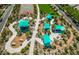 Aerial view of the community park featuring picnic areas with shade structures, landscaping, and a basketball court at 2871 Tanager Hill St, Henderson, NV 89044