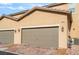 Attached two car garage with brick paver driveway at 2871 Tanager Hill St, Henderson, NV 89044