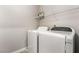 Laundry room with washer, dryer, and shelving at 2871 Tanager Hill St, Henderson, NV 89044
