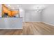 Open floor plan with modern light fixture blending living and kitchen spaces at 2871 Tanager Hill St, Henderson, NV 89044