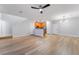 Open living area showcasing wood-look floors and seamless flow to the kitchen at 2871 Tanager Hill St, Henderson, NV 89044