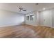 Bright living room showcasing wood-look flooring, neutral walls, and abundant natural light at 2871 Tanager Hill St, Henderson, NV 89044
