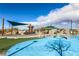 Community playground featuring a splash pad, play equipment, and picnic pavilions at 2871 Tanager Hill St, Henderson, NV 89044