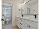 A well-lit bathroom featuring a double sink vanity and black hardware at 2894 Matese Dr, Henderson, NV 89052