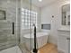 Bathroom view featuring a tiled shower, a glass block window, and a freestanding tub at 2894 Matese Dr, Henderson, NV 89052