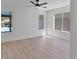 Spacious bedroom with three windows offering views of the outdoor area at 2894 Matese Dr, Henderson, NV 89052