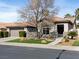 Charming single-story home with a tile roof, well-maintained landscaping, and an attached two-car garage at 2894 Matese Dr, Henderson, NV 89052