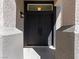 Elegant black double front doors with a textured exterior and an overhead window to allow natural light at 2894 Matese Dr, Henderson, NV 89052