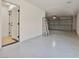 Bright and spacious garage features sealed flooring, access door to the house, and automated door at 2894 Matese Dr, Henderson, NV 89052