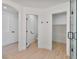 Hallway shot featuring a bathroom and closet entrance at 2894 Matese Dr, Henderson, NV 89052