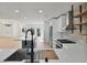 Modern kitchen featuring white cabinets, a center island and stainless appliances at 2894 Matese Dr, Henderson, NV 89052