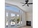 Living room with light wood-look floors features a fireplace and a view of the backyard at 2894 Matese Dr, Henderson, NV 89052