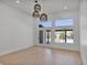 Spacious living room with hardwood floors, lots of natural light, and a ceiling fan at 2894 Matese Dr, Henderson, NV 89052