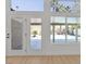 A brightly lit living space features light wood-look floors and a large backyard view through double doors at 2894 Matese Dr, Henderson, NV 89052