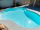 The inviting pool features steps for easy access and cool, clear water, perfect for hot days at 2894 Matese Dr, Henderson, NV 89052