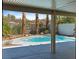 Beautiful private pool featuring mature palms and desert landscaping, offering a serene outdoor oasis at 2894 Matese Dr, Henderson, NV 89052