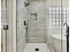 The shower showcases gray subway tile, black fixtures, and a frameless glass door at 2894 Matese Dr, Henderson, NV 89052